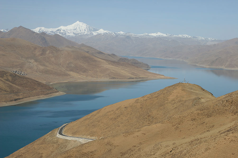 View over Yamdrok Lake with snowy mountains in the background