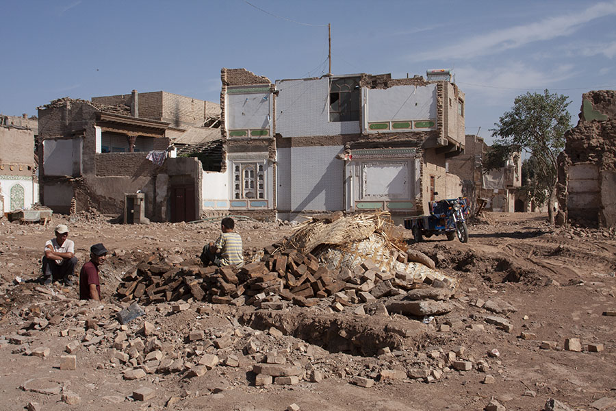 Uyghurs in the old town of Kashgar, being demolished