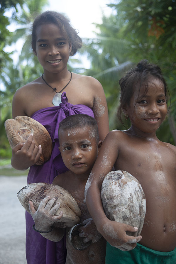 Kids with coconuts on Abaiang atoll